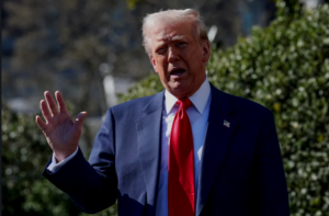 Trump speaks too reporters on the South Lawn of the White House