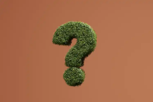 Question mark covered with green plants